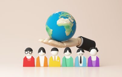 Diverse group of people holding hands around a globe, symbolizing inclusion, equality, and sustainability.